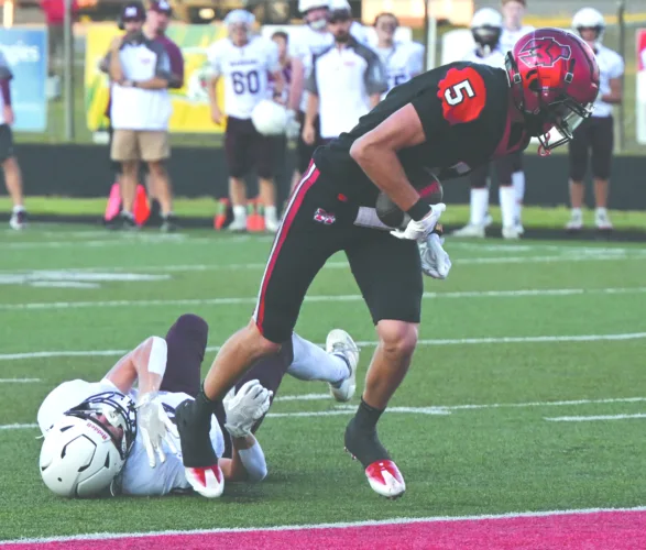 Maroons’ offense too strong: Defending state champs take it to Marquette, 49-19